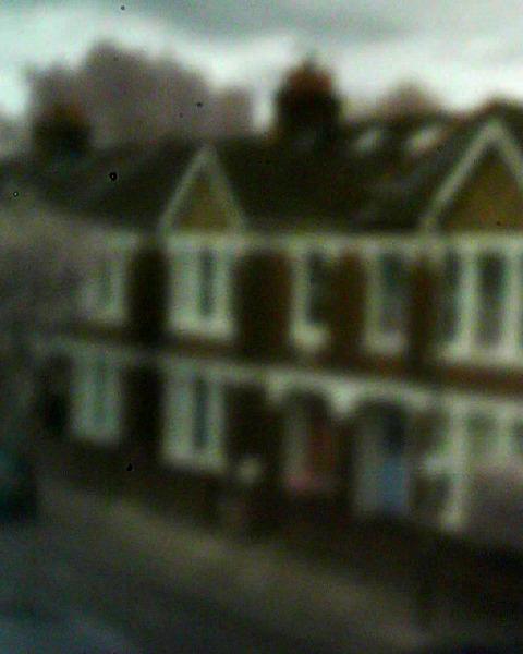 Picture of houses taken with pinhole webcam Picture of houses taken with pinhole webcam